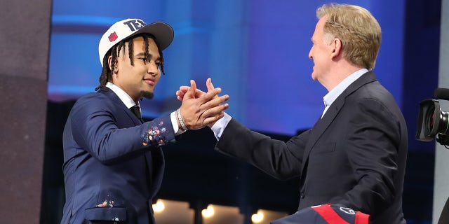 CJ Stroud shakes hands with Roger Goodell