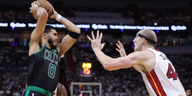 Jayson Tatum looks to pass