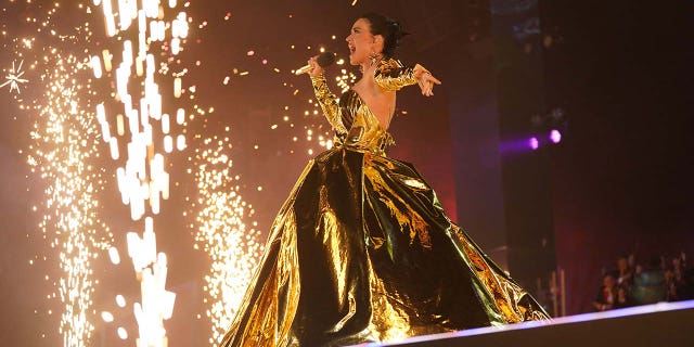 Katy Perry wears gilded gown for coronation concert at Windsor Castle.