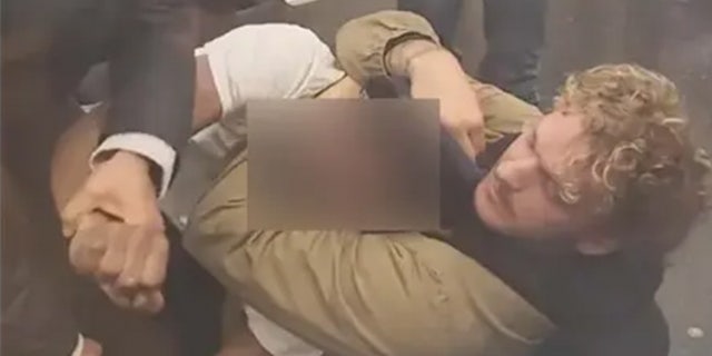 Daniel Penny shown holding Jordan Neely in a chokehold.