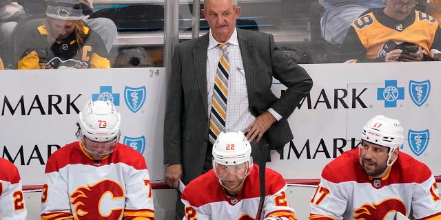 Darryl Sutter is behind the Flames' bench