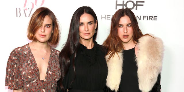 Demi Moore poses with her daughters