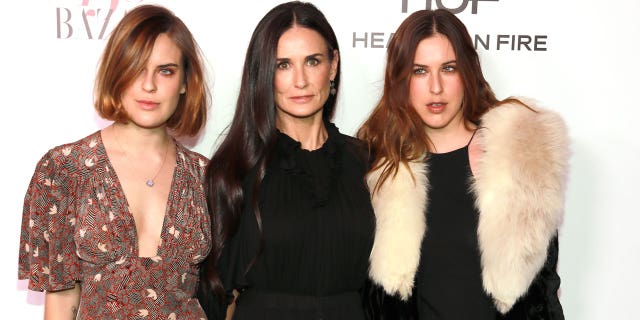 Demi Moore poses with her daughters