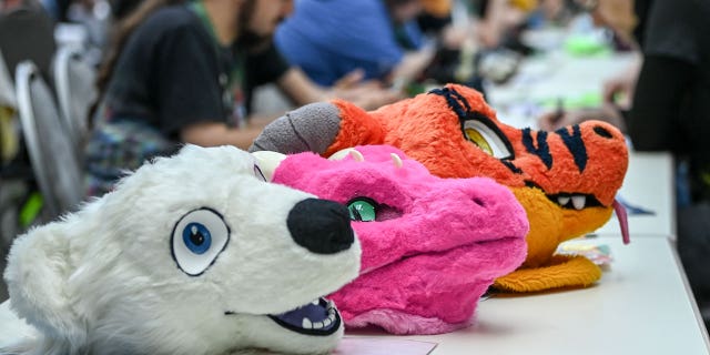 Furry heads displayed at a convention