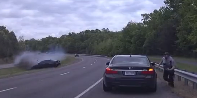 Virginia police officer runs for cover to avoid crash