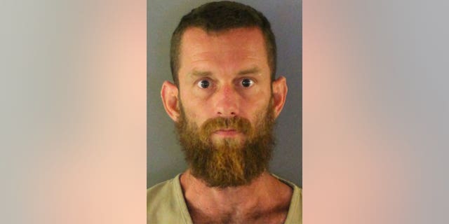 Mugshot of the Florida who had his dead mother decomposing at his residence.