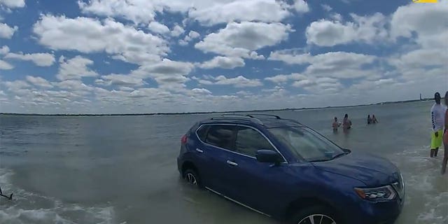 SUV in the water.