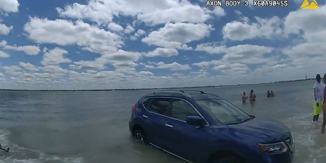 SUV in the water.