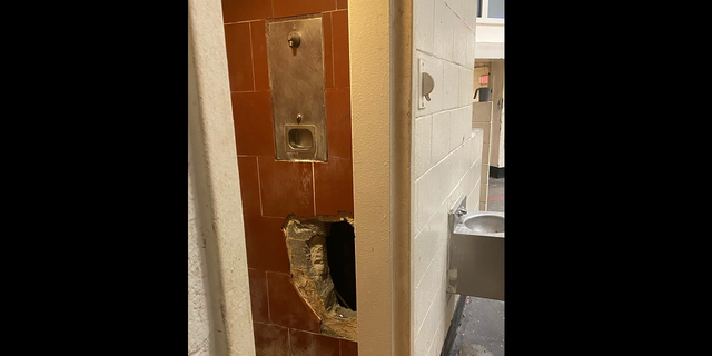 Hole in Fulton County Jail shower stall