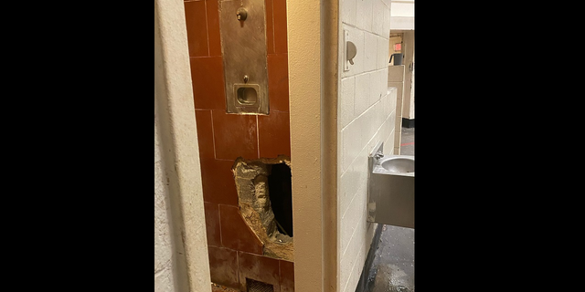 Hole in Fulton County Jail shower stall