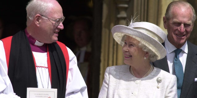 Then-Archbishop Carey with Queen Elizabeth II in 2002