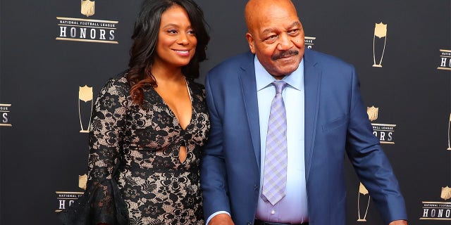 Jim Brown poses for photos