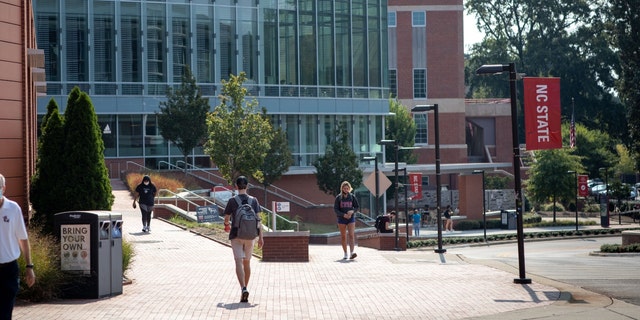 Students walk past the Tolley Student Center on campus at North Carolina State University in Raleigh, North Carolina, U.S., on Monday, Sept. 13, 2021.