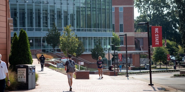 Students walk past the Tolley Student Center on campus at North Carolina State University in Raleigh, North Carolina, U.S., on Monday, Sept. 13, 2021.