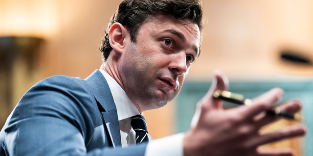 Jon Ossoff motioning with is hands