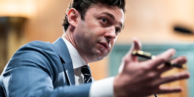 Jon Ossoff motioning with is hands