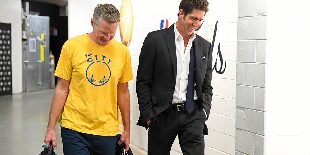 Bob Myers and Steve Kerr walk into the arena