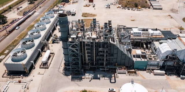 A power generating station during a heatwave outside of Austin, Texas, US, on Monday, July 11, 2022. Texas residents and businesses, including the biggest names in oil, autos and technology, are being asked to conserve electricity Monday afternoon during a heat wave that's expected to push the state's grid near its breaking point. Photographer: Jordan Vonderhaar/Bloomberg