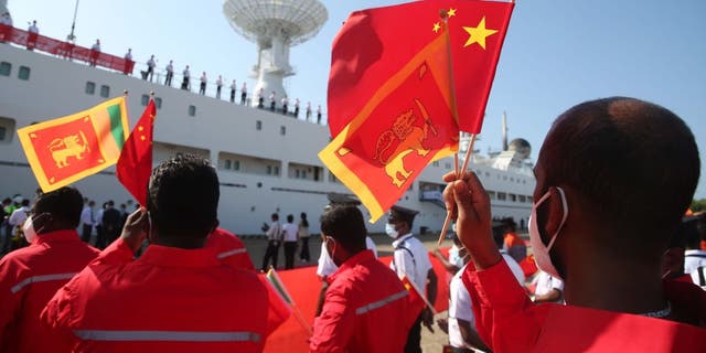 People waving Chinese flags in Sri Lanka