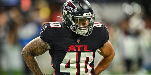 Keith Smith warms up before a Falcons game