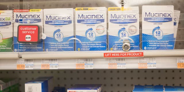 Mucinex behind case at pharmacy