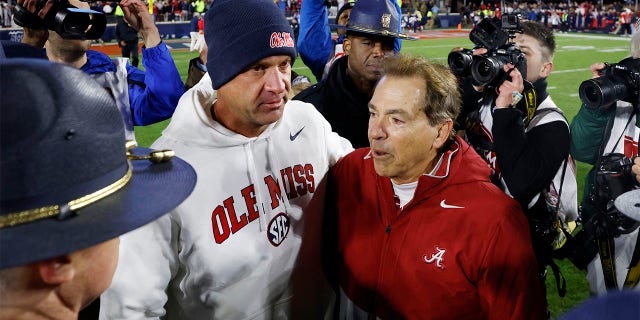 Nick Saban and Lane Kiffin meet after a game