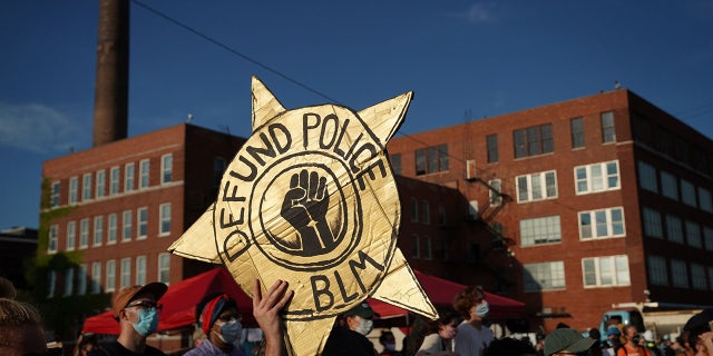 Defund the Police protester sign