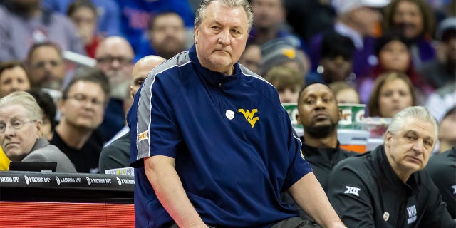 Bob Huggins coaches during the Big 12 Tournament