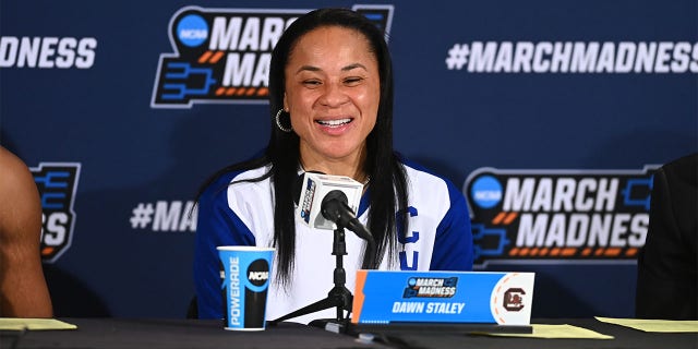 Dawn Staley talks to the media