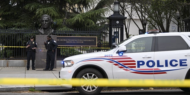 DC police cruiser behind police tape