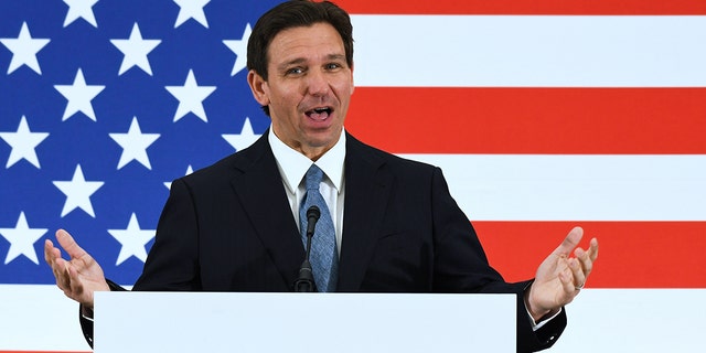 Florida Gov. Ron DeSantis speaking in front of American flag