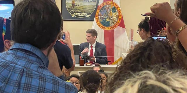 Florida protesters gather at DeSantis office
