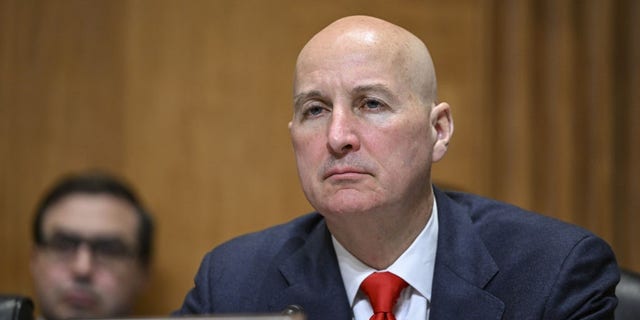 Pete Ricketts wearing a suit and tie