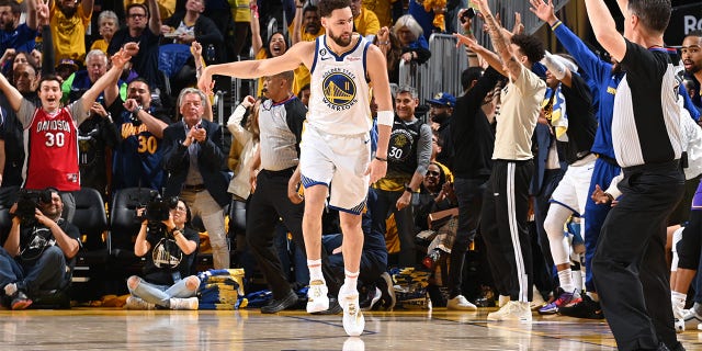 Klay Thompson celebrates after hitting a shot