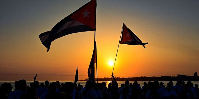 Cuban protesters at sunset