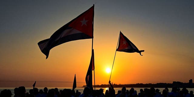 Cuban protesters at sunset