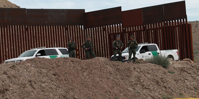 Border patrol stand by "Hugs Not Walls" events