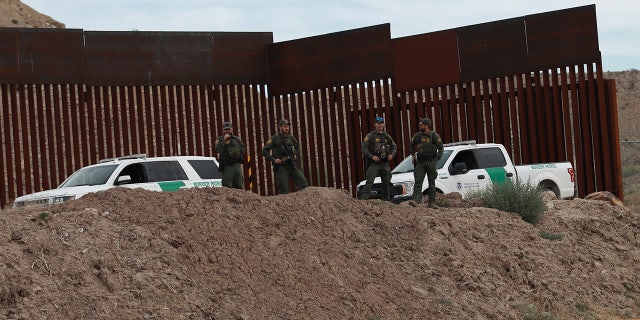 Border patrol stand by "Hugs Not Walls" events