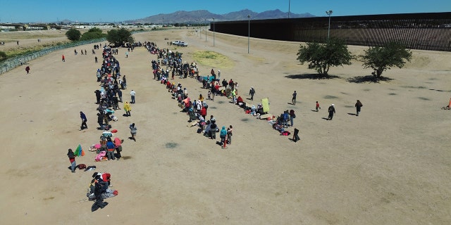 Migrants crossing into the US