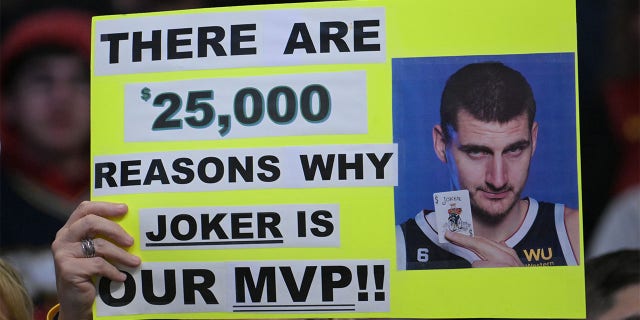 A fan holds a sign for Nikola Jokic
