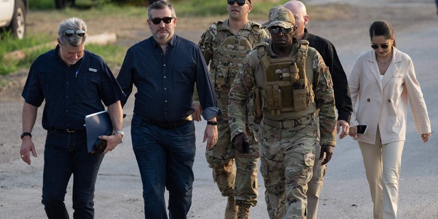 Sen. Ted Cruz walking with group toward border