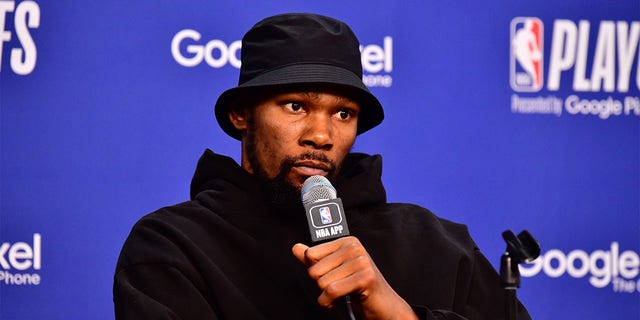 Kevin Durant talks to the media