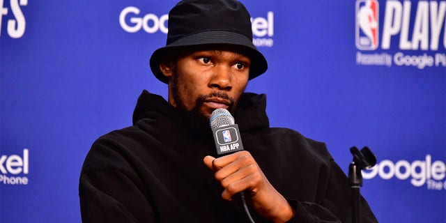 Kevin Durant talks to the media