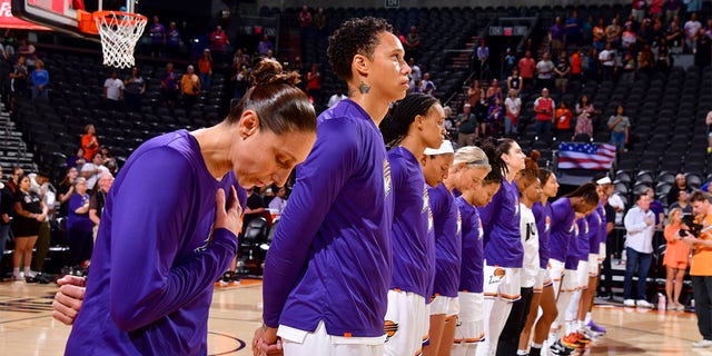 The Phoenix Mercury stand for the national anthem