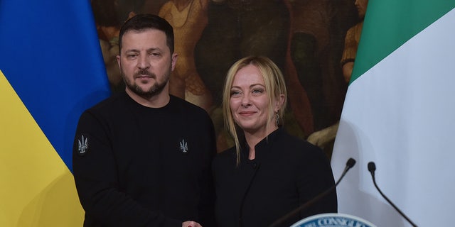 Zelensky shakes hands with the Italian prime minister