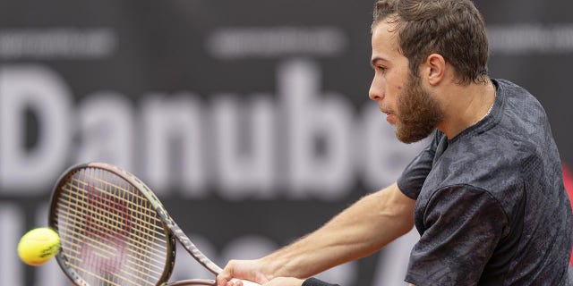 ATP Tour fines French tennis player more than 2023 total earnings after unsportsmanlike conduct violation 4 Hugo Gaston plays a shot during the 2023 Austria Open