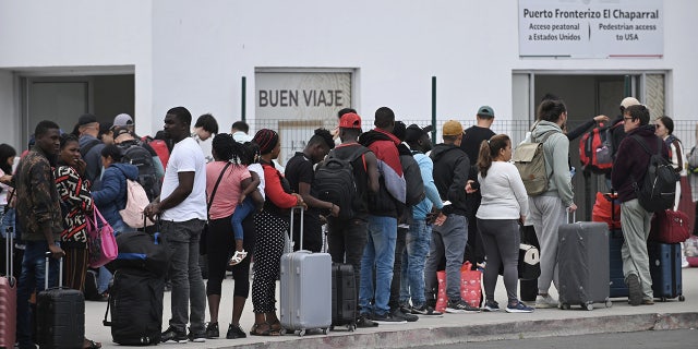 Migrants surge at California border port of entry