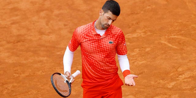 Novak Djokovic reacts to his play during the quarterfinal match at the Italian Open