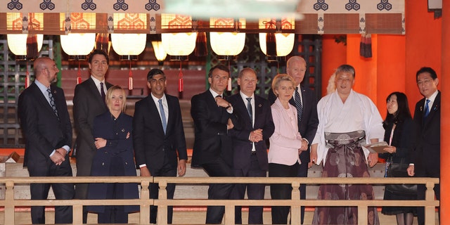 (L to R) European Council President Charles Michel, Canada's Prime Minister Justin Trudeau, Italy's Prime Minister Giorgia Meloni, Britain's Prime Minister Rishi Sunak, France's President Emmanuel Macron, Germany's Chancellor Olaf Scholz, European Commission President Ursula von der Leyen, US President Joe Biden and Japan's Prime Minister Fumio Kishida (R) pay a visit to Itsukushima Shrine on Miyajima island, near Hiroshima, during the G7 Summit Leaders' Meeting on May 19, 2023.