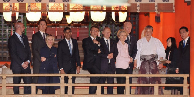 (L to R) European Council President Charles Michel, Canada's Prime Minister Justin Trudeau, Italy's Prime Minister Giorgia Meloni, Britain's Prime Minister Rishi Sunak, France's President Emmanuel Macron, Germany's Chancellor Olaf Scholz, European Commission President Ursula von der Leyen, US President Joe Biden and Japan's Prime Minister Fumio Kishida (R) pay a visit to Itsukushima Shrine on Miyajima island, near Hiroshima, during the G7 Summit Leaders' Meeting on May 19, 2023.